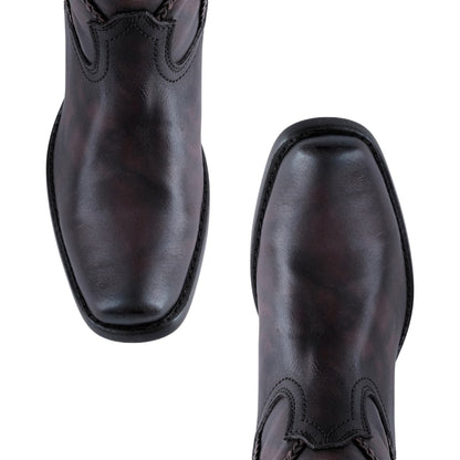 Botas de piel estilo vaquero con trenzados en diseño ondulado